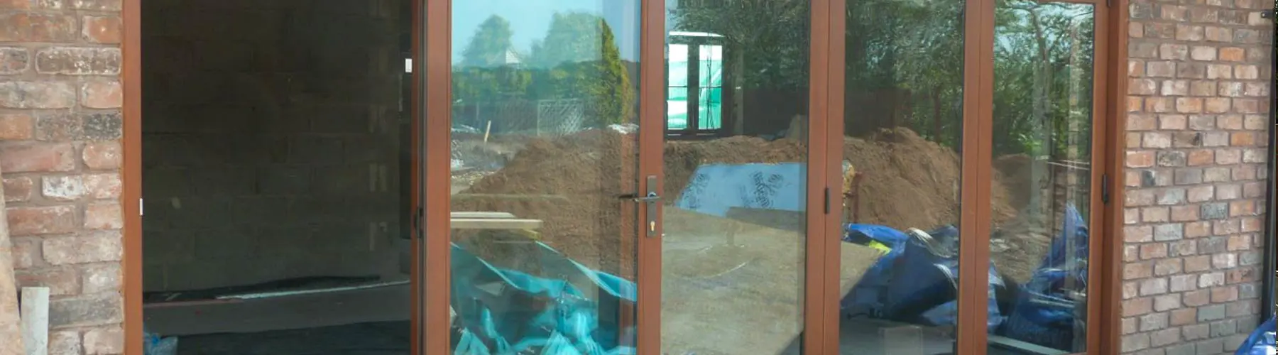 5 panel timber sliding doors, installed in a new build Formby, Liverpool.