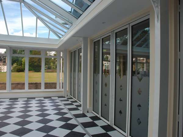 North Wales Mold - Installation of classic S1 White Aluminium Bi fold doors double glazed in a K2 Portal Conservatory - Glass Celsius one clear