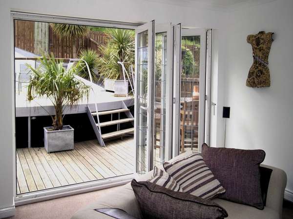 Hoylake, Wirral. Installtion of Slimfold AC10 White PvcU Bi folding doors. Double glazed with Hytherm Double glazed units