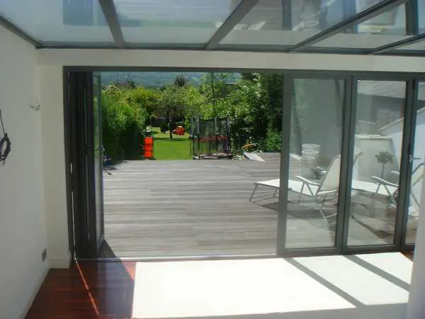 Mr & Mrs E. Neston, South Wirral : Installation of Slimfold A10 Aluminium Bi Fold doors , Triple glazed . marine finish Polyester Powder coated RAL 7037 ; Roof K2 PvcU Aluminium roof system glazed in Celsius clear. overall U value 1.4