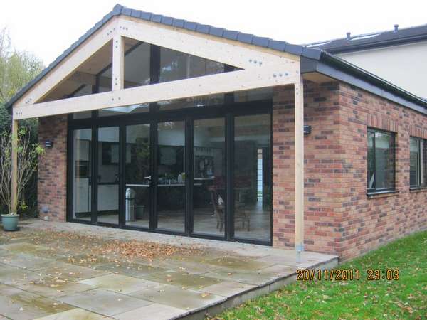 Mr S.: Hartford cheshire : 6m x 4m atrium window, Centor Aluminium Bi folding doors with 70mm - 300s Aluminium Frames. Double glazed with Pilkington Soft coat Low E Double glazed units, argon gas filled with warm edge spacer. structural steel over capped