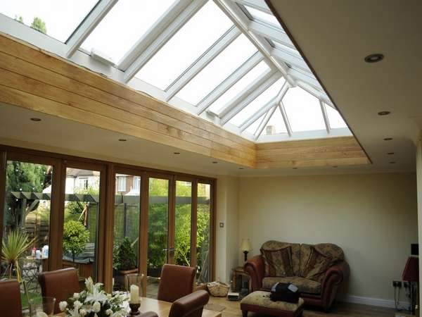 Cheadle Manchester. Internal view of a pair of G Barnsdale's Oak Bi Fold doors in there slimline section double glazed. Skylight HWL Ornate to complement the timber door. Marine Finish Aluminium with 4 no Rain censored Electric roof vents.