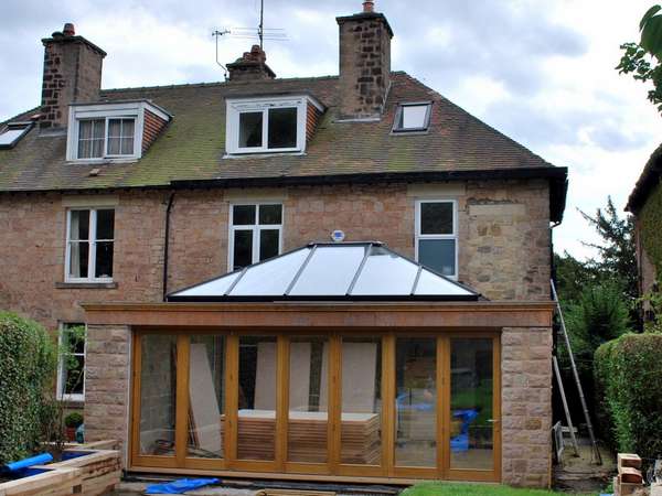 Cheadle Heath . Cheshire : Installation of HWL Roof Lantern with G. Barnsdale Timber Bi Fold doors.Skylight Painted to match Oak Bi Fold doors
