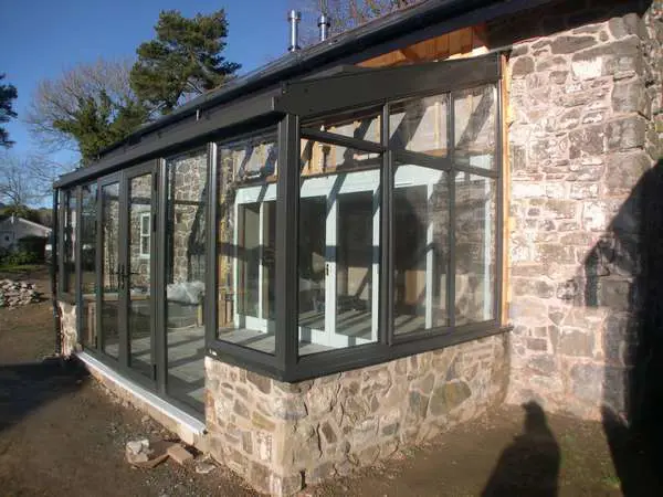 Mr & Mrs R: Knutsford, Chesire: Instalation of Allstyle aluminium windows triple glazed in a marine finish polyester powder coating: Ral 7016: centor C1 triple glazed bifold doors with 44 mm units U Value 0.7
