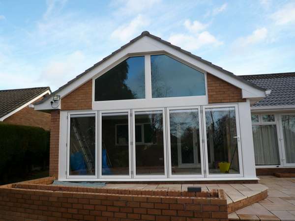 Mr & Mr T. Gayton Wirral. Installation of White aluminium Bi fold doors and windows - Classic S1 Aluminium - Double glazed - Internal Blinds to the Bi fold doors