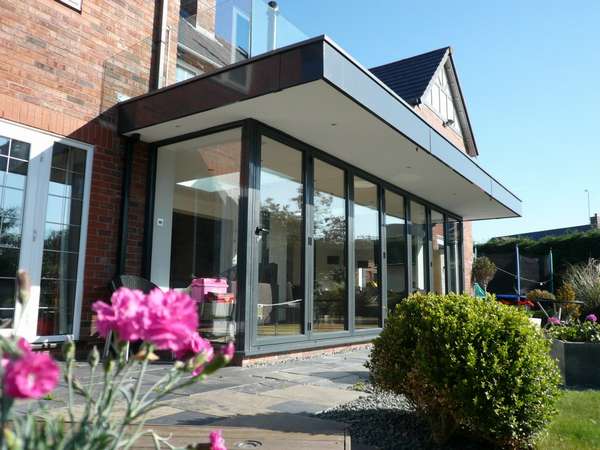 Caldy Wirral : Design and build - Centor C1 Bi fold doors - sarnafil roof cover. Aluminium Fascias