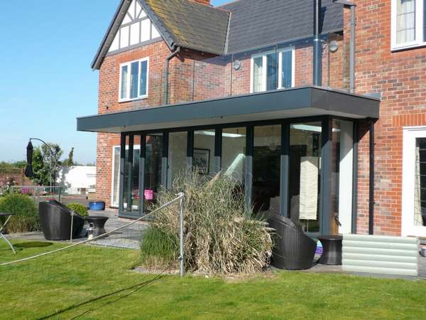 Caldy wirral : design and build: CLR Balustrade system 15mm heat-soak Toughened glazing: Centor C1 44mm triple glazed Bi fold doors