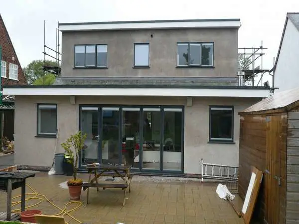 West Kirby Wirral : Installation of Slimfold A10 Bi fold doors double glazed U value 1.4 . 300 series Aluminium windows double glazed. Morley Internal blinds to all glass units