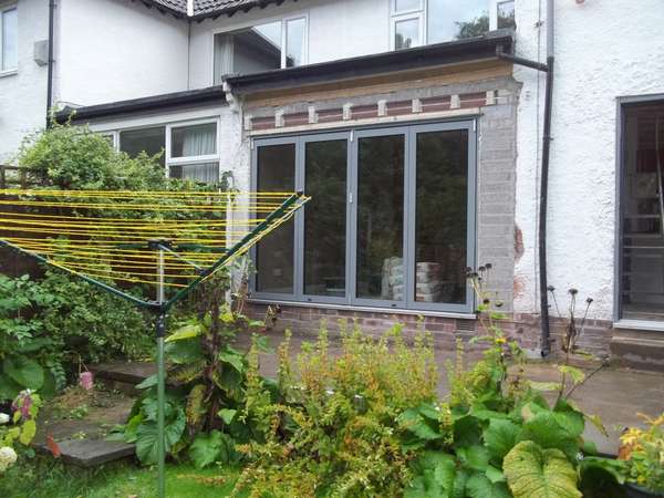 Mr & Mrs L. Bebington Wirral. : Structural Alteration including installing Steel lintels to form larger opening. Centor C1 Bi Fold doors triple glazed with 44mm units center pane U value .75 Ral colour marine finish matt 7037