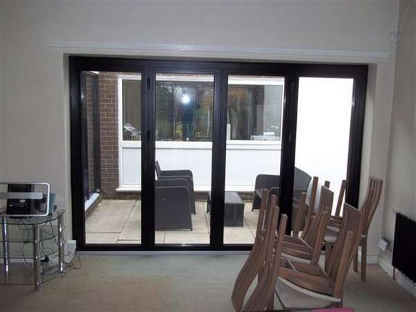 Mr & Mrs G . Heswall wirral : Installtion Alumnium Bi folding doors in satin Black. Marine Finish Alumnium . Poyester Powder Coated Centro C1 aluminium Bi-fold door triple glazing Bi fold door Chester CH1 near Wilmslow near Alderley Edge SK9. Aluminium