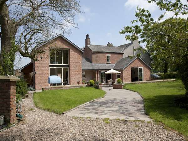 Malpas, Cheshire. Installation of Slimfold A10 Aluiminium Bi fold doors and matching windows, double glazed with argon gas filled units. Marine coated Polyester powder coated RAL 1015